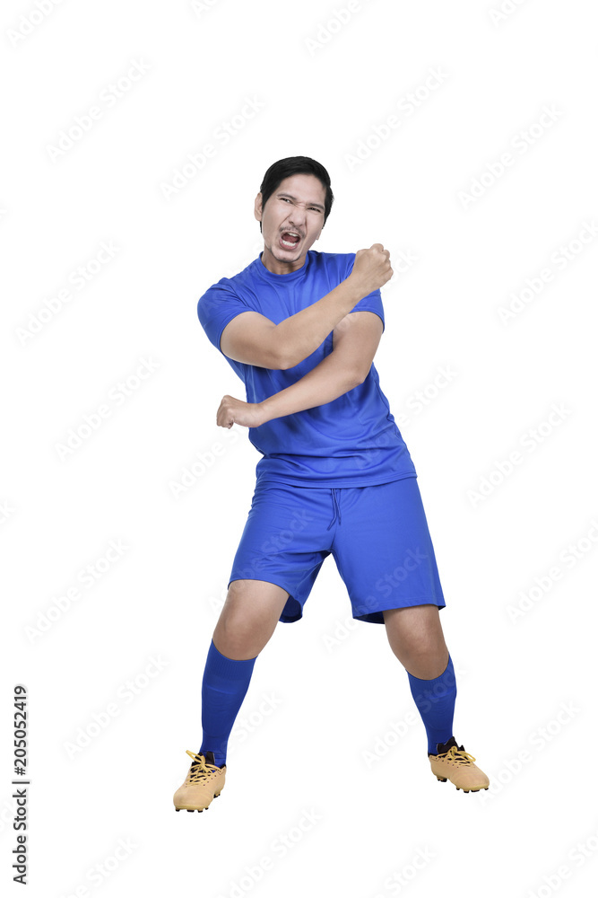 Attractive asian soccer player with excited expression