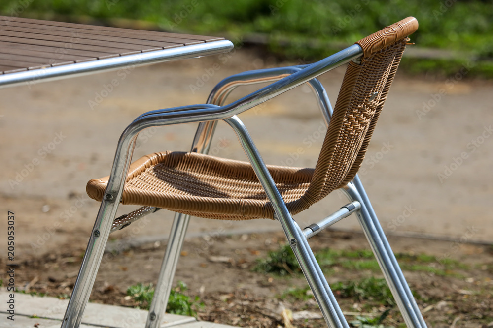 A chair in a summer cafe in the park