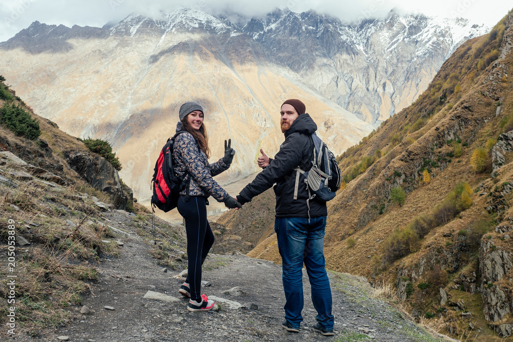 couple walks along the mountainous terrain in Georgia