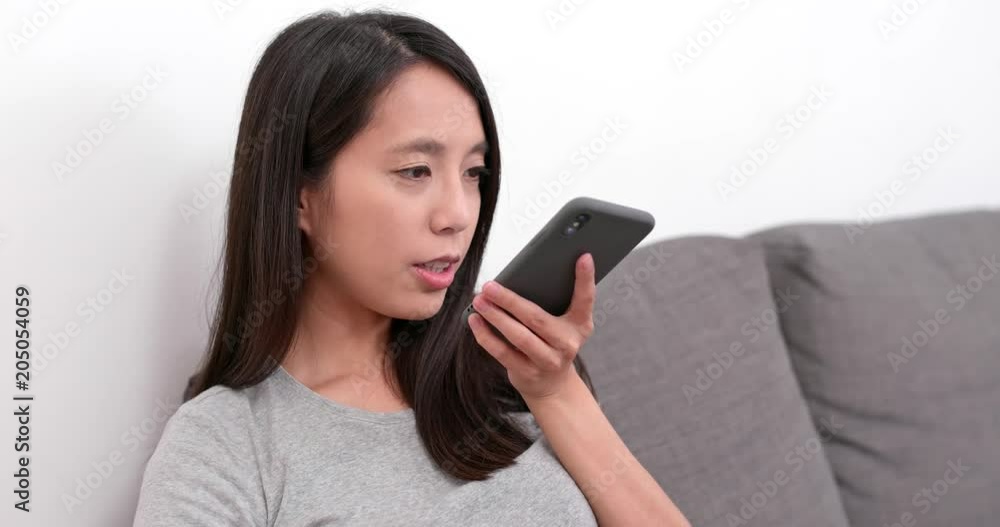 Woman sending audio message on mobile phone Woman sending audio message on mobile phone