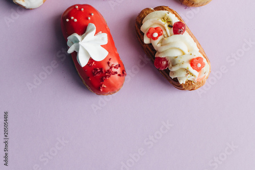 assorted delicious sweets on purple background