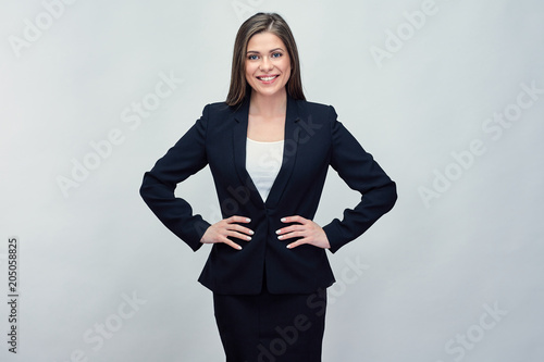 Woman wearing black business suit.