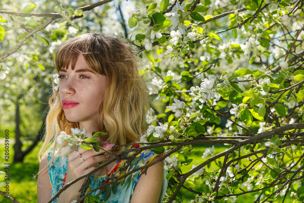 Beautiful young woman in blooming garden Beautiful young woman in blooming garden