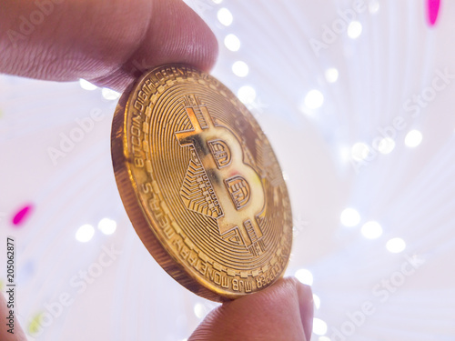 Bitcoin with coins on computer board and copy space using as background technology, money finance, business concept. photo