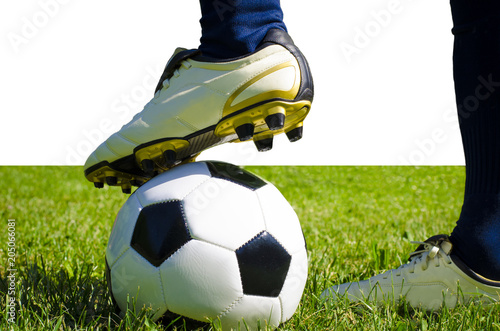 Legs of football player, soccer player and soccer ball isolated white background with copy space use for sport and athletic topic photo