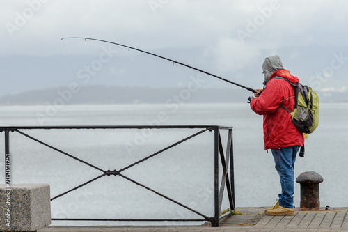 man on a fishing trip on a pier 