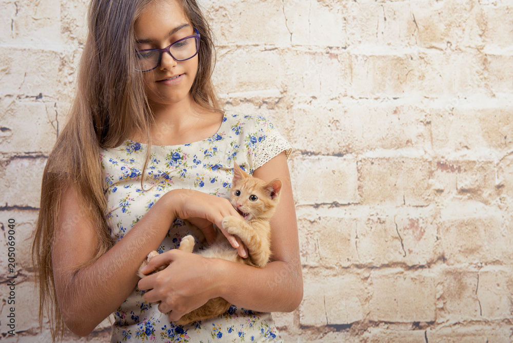 favorite kitten. girl is holding a red kitten. little funny red cat biting fingers girl playfully. Ginger kitten in her arms. girl and funny little kitten
favorite kitten. girl is holding a red kitten. little funny red cat biting fingers girl playfully. Ginger kitten in her arms. girl and funny little kitten