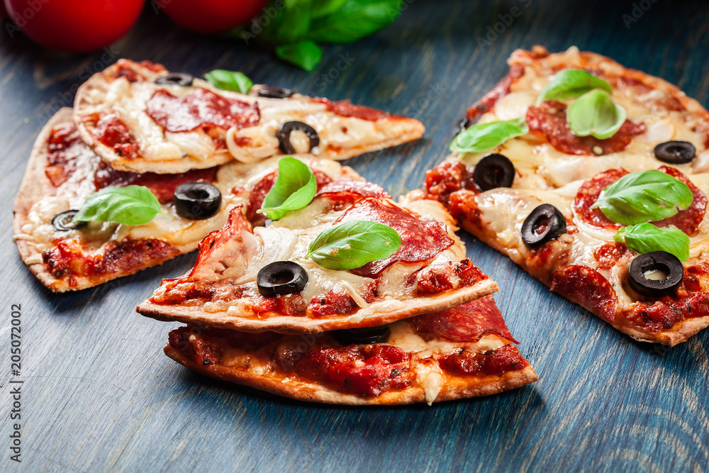 Slices of pizza pepperoni with olives Slices of pizza pepperoni with olives