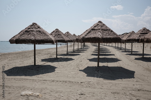 empty umbrellas on the beach of pescara