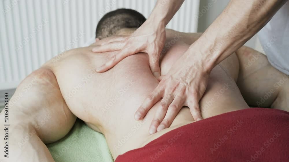 Sports massage for handsome athlete in beauty studio. Close up. 4K Sports massage for handsome athlete in beauty studio. Close up. 4K