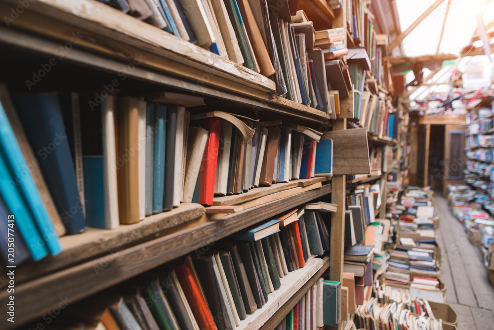 Cozy old library. Shelves with old books. Background. Cozy old library. Shelves with old books. Background.
