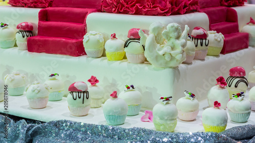 Homemade topping sweet wedding cupcake./ Homemade sweet beauty flower and topping decoration on wedding cupcake.