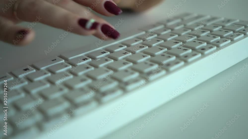 Female hands print text on the computer keyboard close-up. 4k Female hands print text on the computer keyboard close-up. 4k