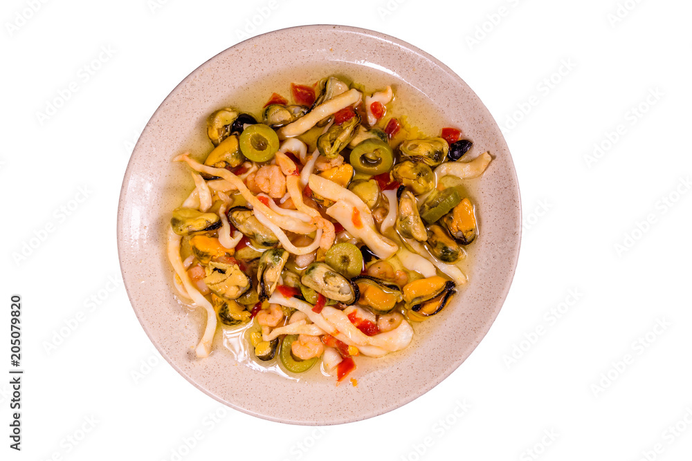 Ceramic plate with the different sea food and olives isolated on white background Ceramic plate with the different sea food and olives isolated on white background