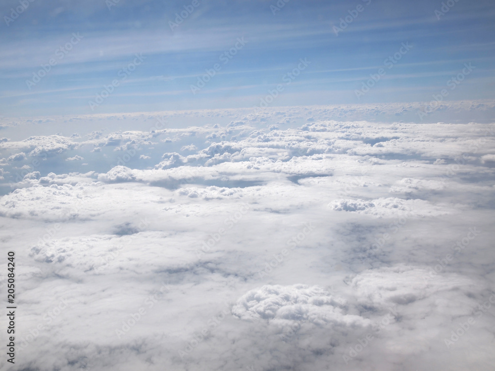 Blue sky with clouds, a view from airplane window Blue sky with clouds, a view from airplane window