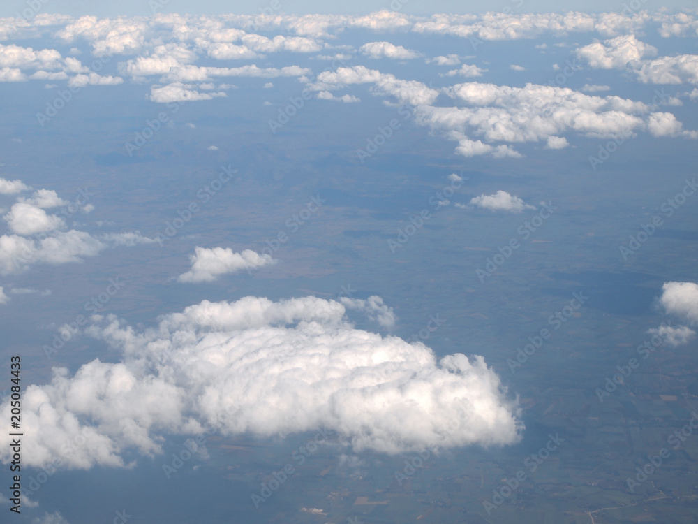 Blue sky with clouds, a view from airplane window Blue sky with clouds, a view from airplane window