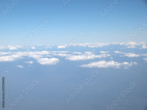 Blue sky with clouds, a view from airplane window