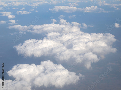 Blue sky with clouds, a view from airplane window