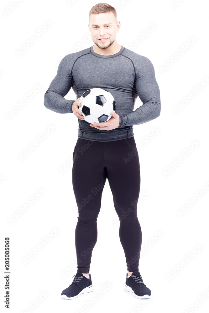 Isolated portrait of well-muscled male athlete holding soccer ball Isolated portrait of well-muscled male athlete holding soccer ball