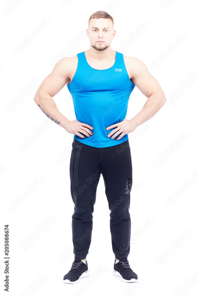 Portrait of strong athletic man in sports clothes posing on white background Portrait of strong athletic man in sports clothes posing on white background