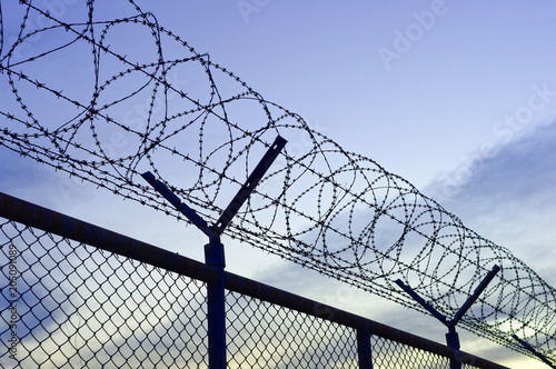 Fence with razor barbed wire