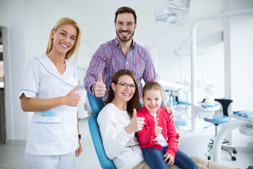 Dentist with sterile mask and dental instruments held exam teeth of patient