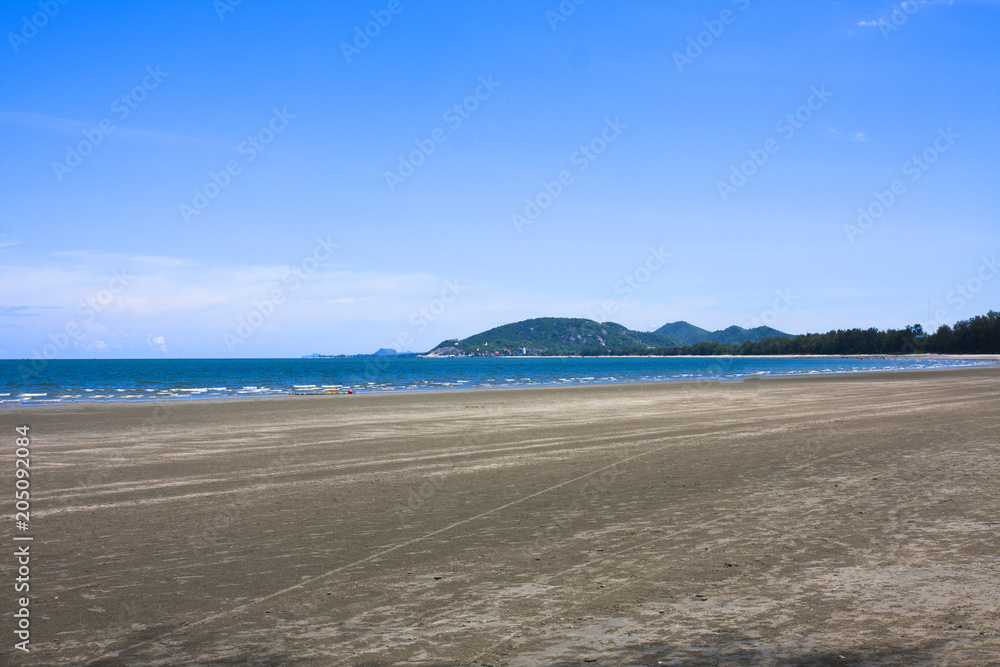 Sea view from tropical beach with sunny blue sky