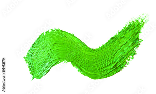 green stroke of the paint brush isolated on white