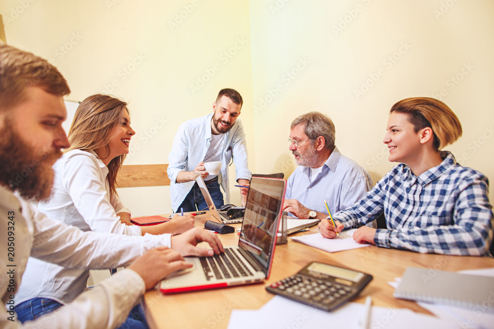 Team job. Photo young businessmans working with new project in office Team job. Photo young businessmans working with new project in office