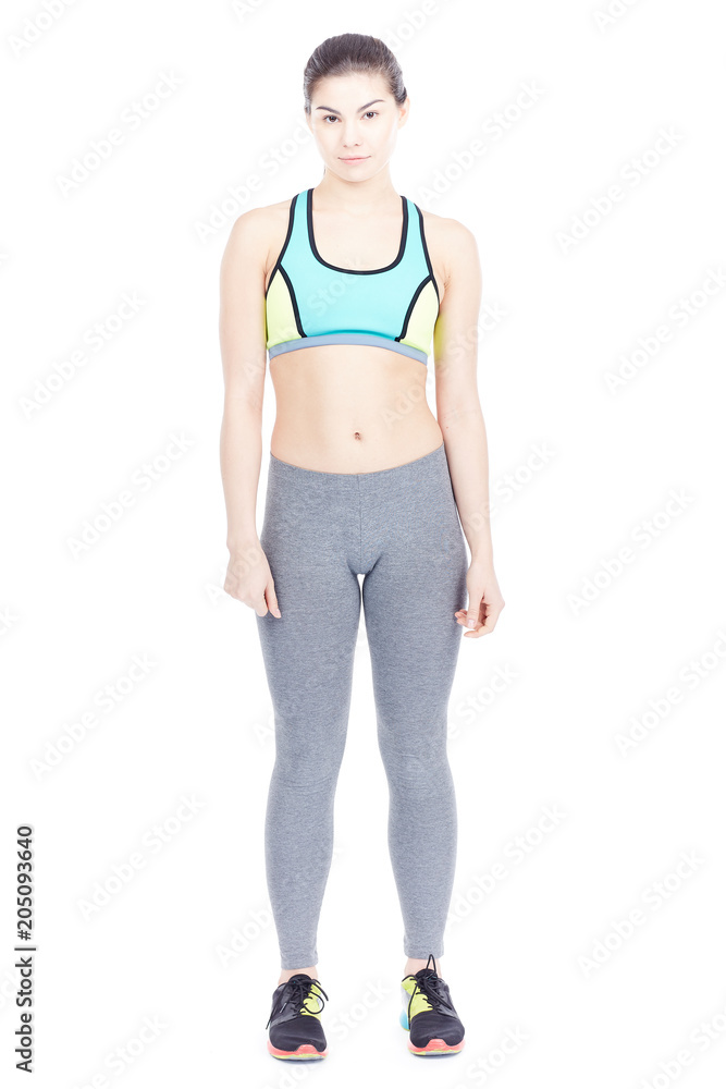 Isolated portrait of beautiful fit woman posing in sports tights and bra Isolated portrait of beautiful fit woman posing in sports tights and bra