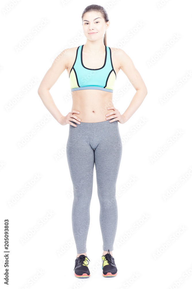 Isolated portrait of beautiful fit woman posing in sports tights and bra Isolated portrait of beautiful fit woman posing in sports tights and bra
