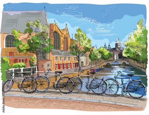 Colorful Bicycles on bridge over the canals of Amsterdam, Netherlands