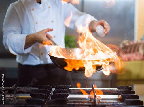 Chef doing flambe on food