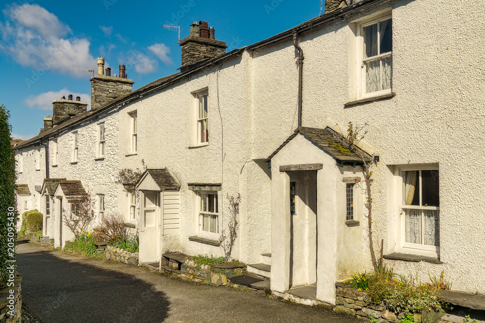 A row of whitewashed cottages in Ambleside, the English Lake Dis