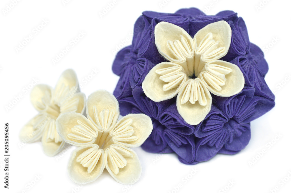 Purple and white origami kusudama flower on white background Purple and white origami kusudama flower on white background