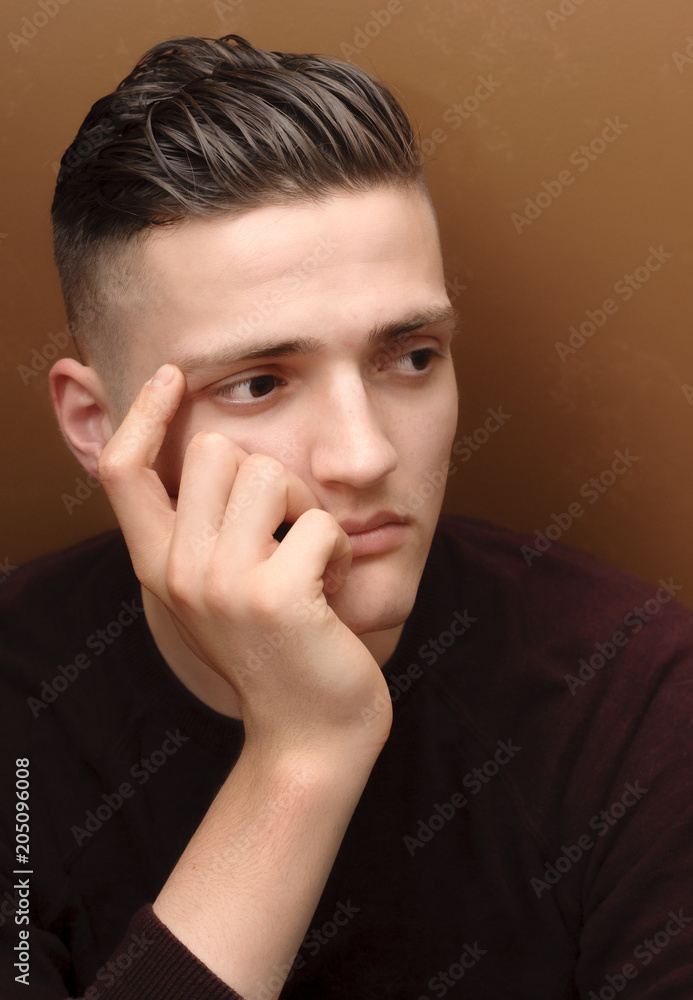 Bored young man thinks that his future is without hope Bored young man thinks that his future is without hope