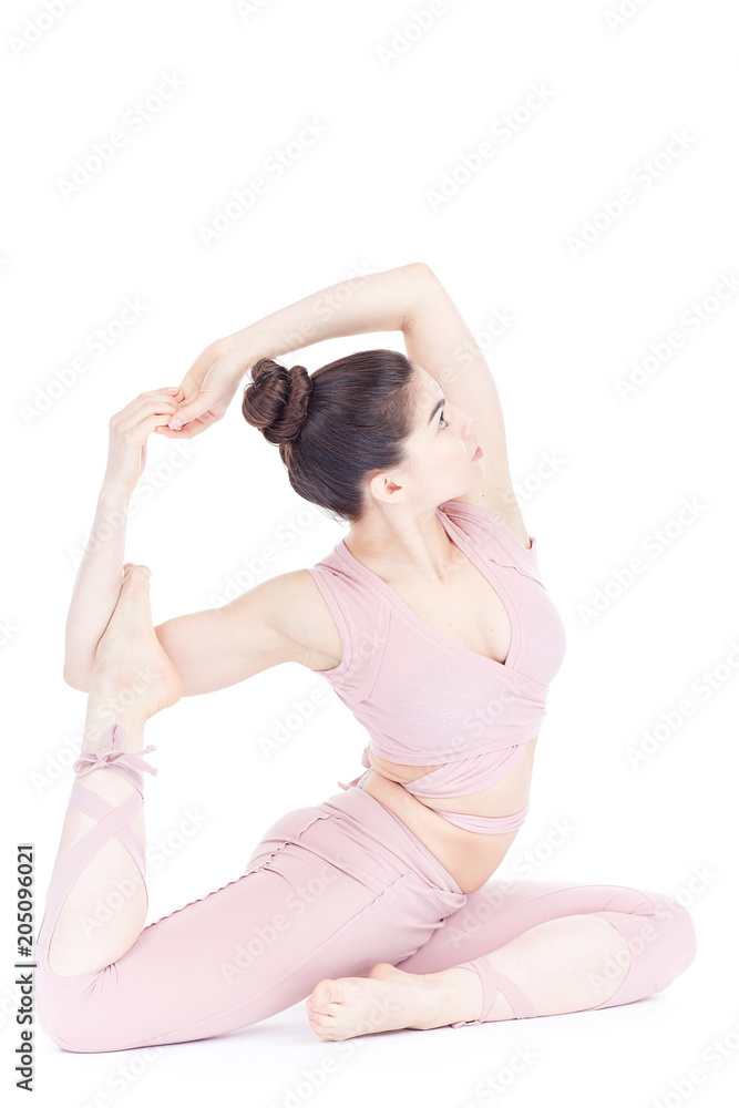 Young woman, professional yoga instructor practicing asanas isolated on white