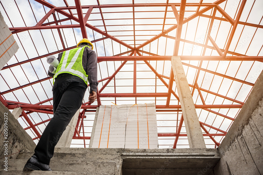 professional engineer worker at the house building construction site professional engineer worker at the house building construction site