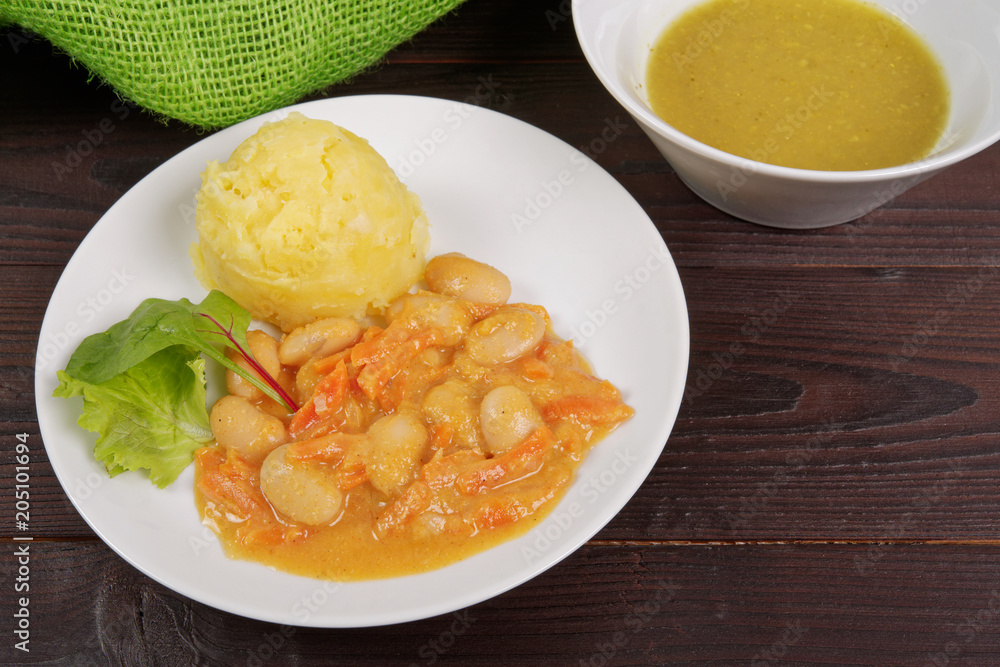Beans with carrots and potatoes on a table Beans with carrots and potatoes on a table