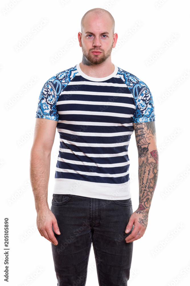 Studio shot of young bald muscular man Studio shot of young bald muscular man