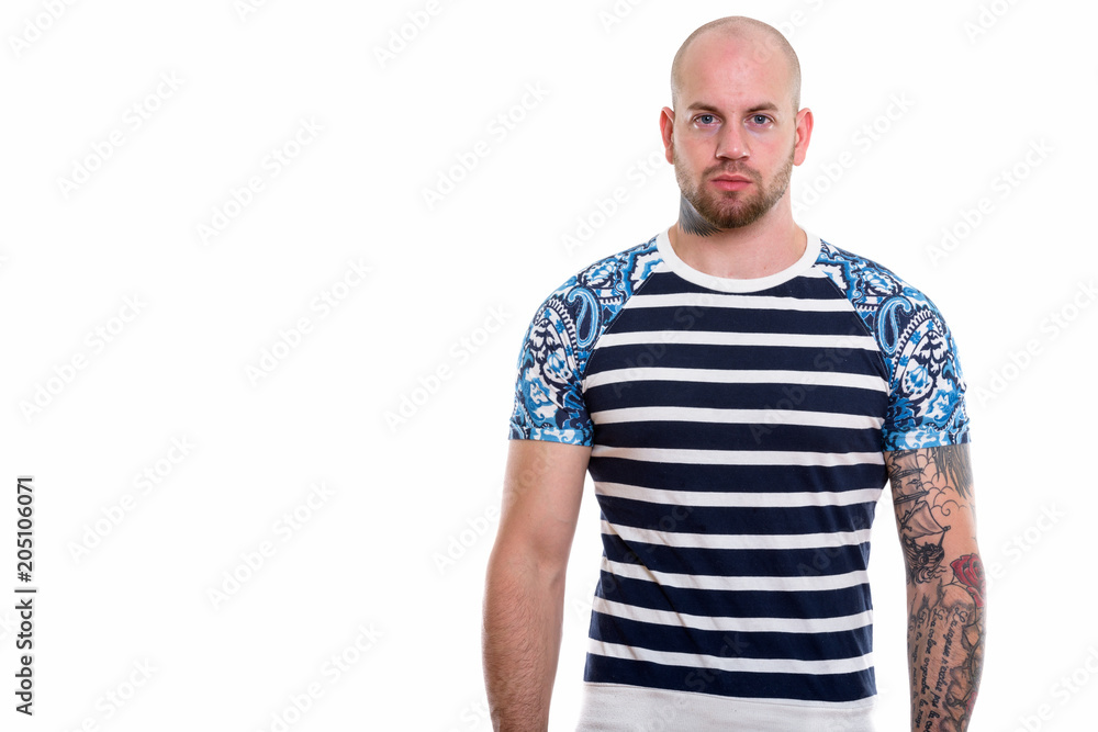 Studio shot of young bald muscular man Studio shot of young bald muscular man