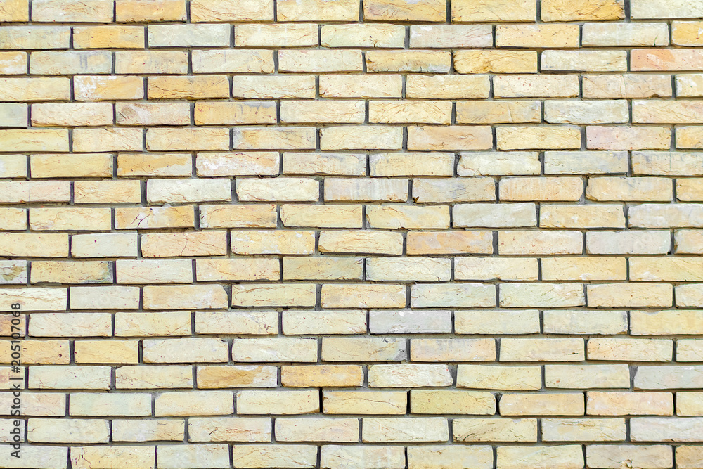Obraz premium Yellow brick wall background