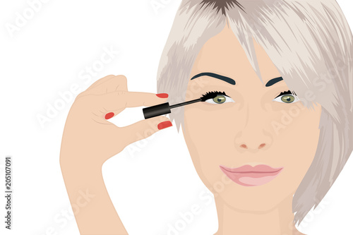 A girl applying mascara on to her eye 