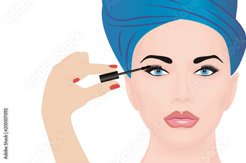 A girl applying mascara on to her eye 