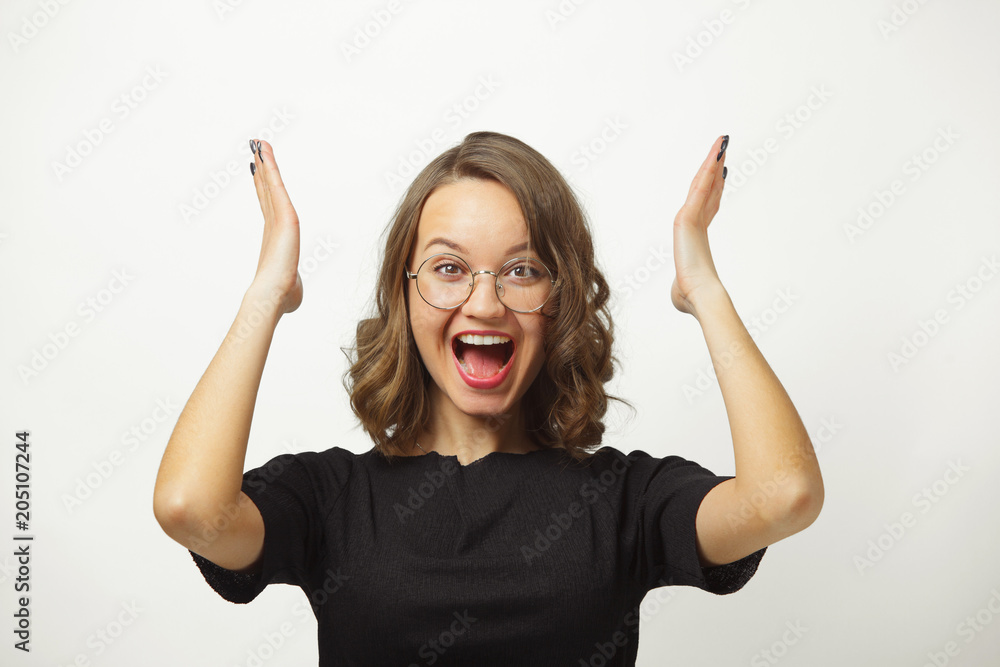 Isolated portrait of young woman spreads her hands in panic or confusion, can not cope with large amount of tasks, expresses confusion and shock. Isolated portrait of young woman spreads her hands in panic or confusion, can not cope with large amount of tasks, expresses confusion and shock.