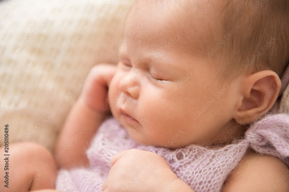 A newborn baby is sleeping. Close-up, selective focus A newborn baby is sleeping. Close-up, selective focus