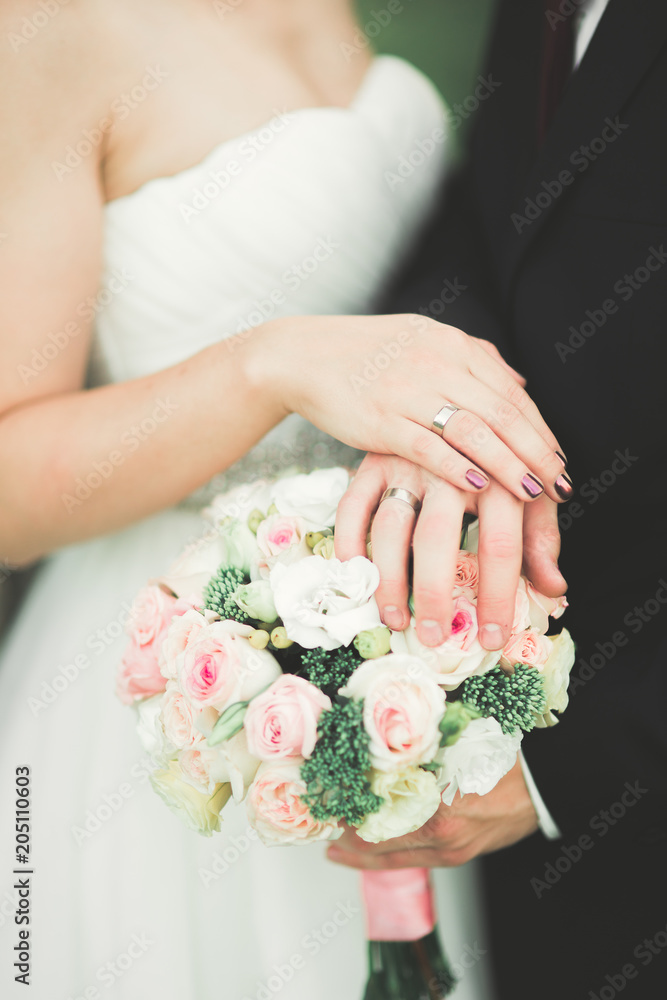 Beautiful fairytale newlywed couple hugging near old medieval castle Beautiful fairytale newlywed couple hugging near old medieval castle