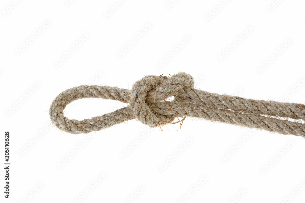 wicker rope tied in knot against white background