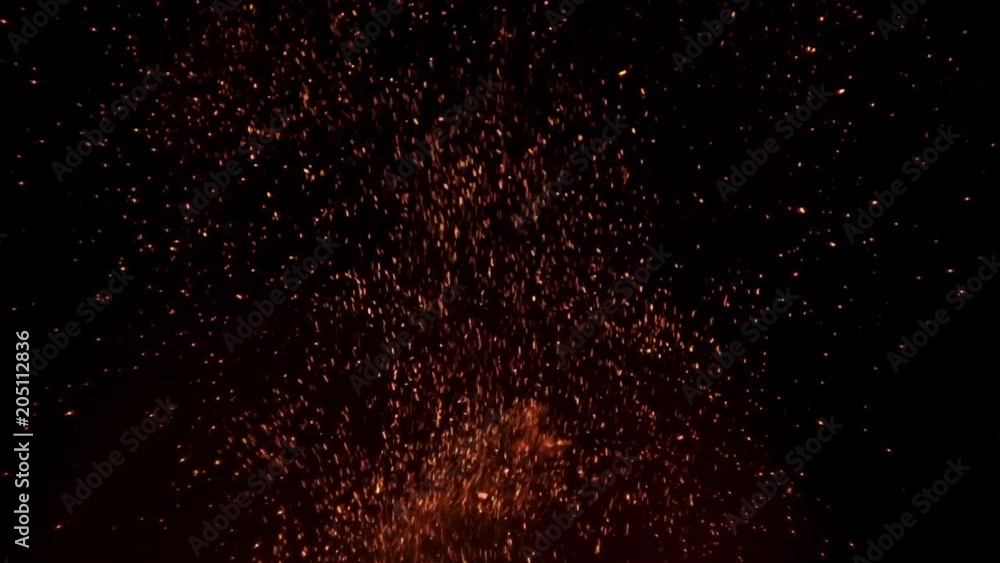 Sparks from the fire slowly climb up on a black background nothing sky Sparks from the fire slowly climb up on a black background nothing sky