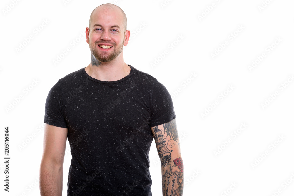 Studio shot of young bald muscular man Studio shot of young bald muscular man